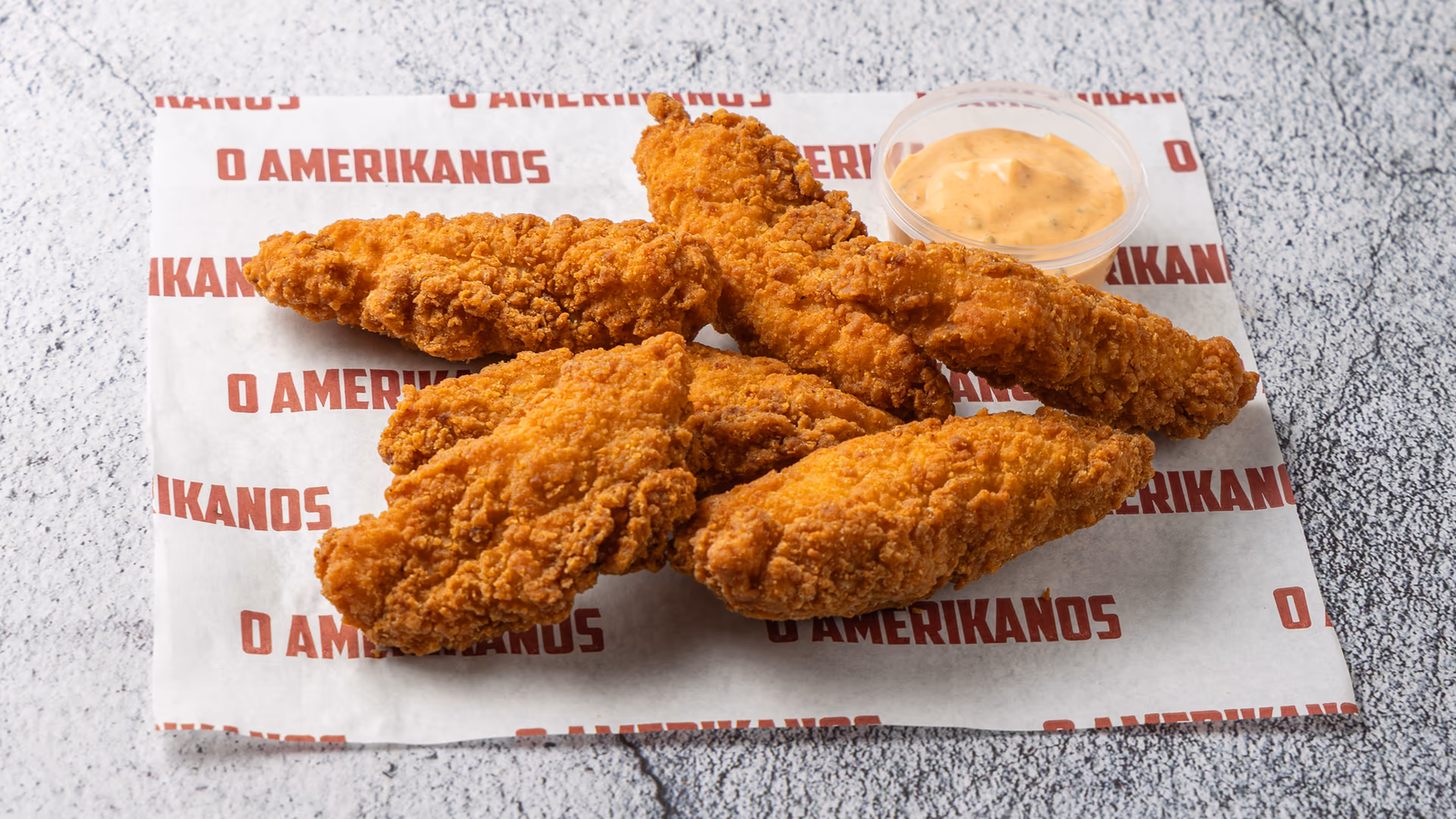 Golden fried chicken tenders with dipping sauce